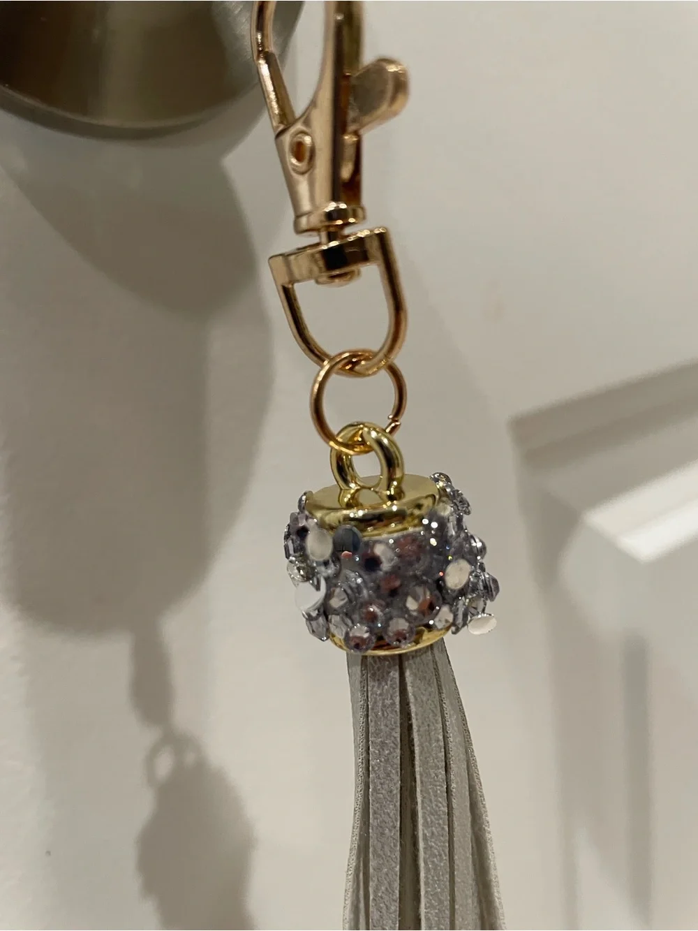 Blinged Keychain w gray leather fringe 🔑 Has goldtone hardware 🗝️ Brand New
